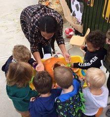 Susan Raisch connecting with children on a playground.