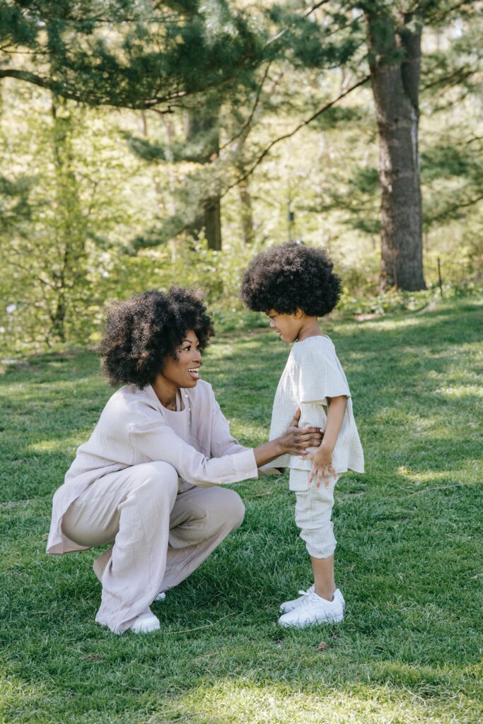 Parent Talking to a child and connecting with them about issues.